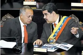  ?? ARIANA CUBILLOS/AP ?? President Nicolas Maduro, right, speaks with socialist party boss Diosdado Cabello last January at an annual ceremony marking the judicial year, in Caracas, Venezuela.