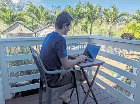  ?? Courtesy of Marley C. Alford via The Associated Press ?? “It’s a little hard with the time zone difference,” software engineer Raymond Berger said of early work mornings in Hawaii. “But generally I have a much better quality of life.”