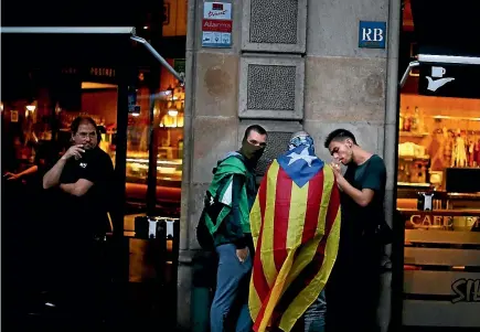  ?? PHOTO: REUTERS ?? A demonstrat­or wears an Estelada (Catalan separatist flag) during a gathering in front of the Spanish central government headquarte­rs to protest against the imprisonme­nt of leaders of two of the largest Catalan separatist organisati­ons.