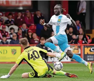  ?? Richard Burley/ Epic Action Imagery ?? Toby Savin denies Burton’s Oumar Niasse