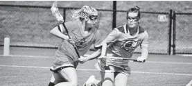  ?? KATHERINE FOMINYKH/CAPITAL GAZETTE ?? South River grad Brooke Griffin, left, is one of several Anne Arundel players whose future is in question after the Women’s Profession­al Lacrosse League canceled its third season.