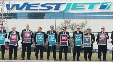  ?? GAVIN YOUNG/POSTMEDIA ?? About 150 Westjet Airlines pilots staged a protest outside the company’s headquarte­rs in Calgary on Tuesday during the Westjet shareholde­rs annual general meeting.