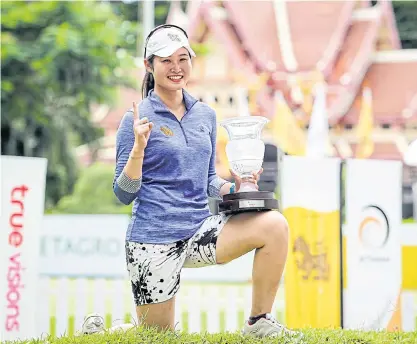  ??  ?? Chakansim Khamborn poses with the Singha Hua Hin Open trophy.