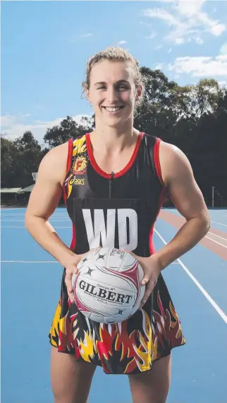  ?? FIRE IN THE BELLY: Firebirds captain Gabi Simpson in a vintage black and red Firebirds dress. ??