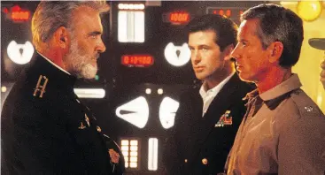 ??  ?? In the 1990 thriller film based on Tom Clancy’s novel of the same name, Sean Connery, left, stars as Captain Marko Ramius and Alec Baldwin as Jack Ryan, centre.