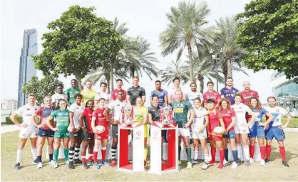  ??  ?? Sixteen men’s and 12 women’s captains line up ahead of the Emirates Airline Dubai Rugby Sevens, which begins at The Sevens on Thursday.