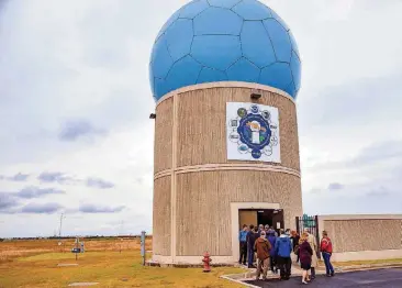  ?? [PHOTO BY CHRIS LANDSBERGE­R, THE OKLAHOMAN] ?? People line up to tour the new Advanced Technology Demonstrat­or weather radar system during its unveiling in Norman on Thursday.