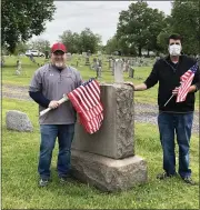  ?? PHOTO COURTESY OF CATHY SKITKO ?? State Rep. Joe Ciresi, right, and Dave Edwards place flags at veterans graves in Pottstown’s Edgewood Cemetery for Memorial Day. Ciresi helped obtain the flags for placement.