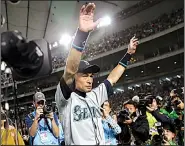  ?? AP/TORU TAKAHASHI ?? Seattle Mariners right fielder Ichiro Suzuki waves to fans after returning to the field after Thursday’s game against the Oakland Athletics at Tokyo Dome. The 45-year-old Mariners star announced his retirement after 19 seasons.