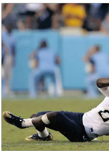  ??  ?? North Carolina’s Ryan Switzer, right, tries to pull away from Terrish Webb. Switzer had