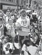  ?? CARY EDMONDSON/USA TODAY SPORTS ?? Among the many summer adventures Steph Curry has already experience­d was cradling the Larry O’Brien Championsh­ip Trophy during the Warriors’ 2018 championsh­ip victory parade in downtown Oakland.