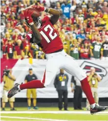  ?? ASSOCIATED PRESS FILE PHOTO ?? Atlanta Falcons wide receiver Mohamed Sanu (12) makes a touchdown catch against the Green Bay Packers in an October game. Atlanta lured Sanu away from Cincinnati with a five-year deal. Sanu responded with a career-high 59 catches, helping the Falcons...