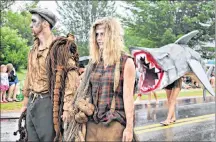  ?? DESIREE ANSTEY/JOURNAL PIONEER ?? Garret Johnson, middle, Catherine Callaghan and shark, Shea Lynn Callaghan keep in “The Shucking Dead” character from start to finish line.