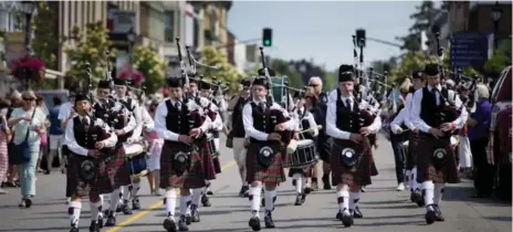  ?? PETER POWER FOR THE TORONTO STAR ?? George Watson’s College Pipes &amp; Drums from Edinburgh is of many world-class bands drawn to Ontario’s summer Scottish festivals.