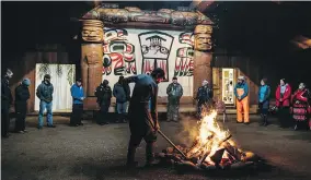  ?? JACKIE DIVES ?? A community member stokes the fire at a welcoming circle for Canada C3 participan­ts in RIVERS INLET, on leg 14 of the C3 expedition, Oct.14.