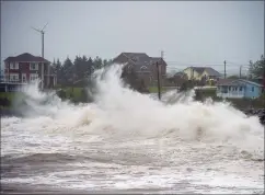  ?? CP PHOTO ANDREW VAUGHAN ?? Waves batter the shore in Cow Bay, N.S., on Wednesday. Hurricane Teddy has impacted the Atlantic region as a post-tropical storm, bringing rain, wind and high waves.