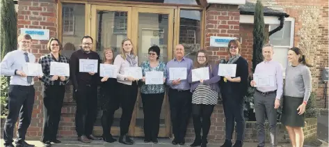  ??  ?? Staff from Thesis Asset Management with their Dementia Friends certificat­es