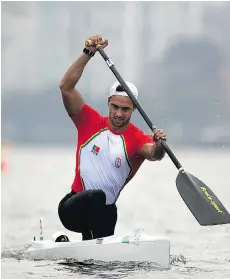  ?? FELIPE DANA/THE ASSOCIATED PRESS ?? Portugal’s Helder Silva competes in the Internatio­nal Canoe Sprint Challenge on Rodrigo de Freitas Lagoon in Rio de Janeiro on Friday. Pollution and weeds were the chief complaints from canoeists.