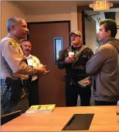  ?? Perry Smith/The Signal ?? From left, Deputy Ray Wilson, volunteer Michael Martinez, Theodore Garcia Jr. and Antonio Grijalva chat at Coffee with a Cop, part of the Sheriff’s Station’s community outreach efforts on March 12.