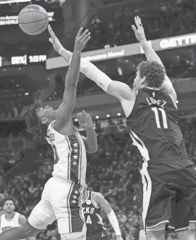  ?? MARK HOFFMAN / MILWAUKEE JOURNAL SENTINEL ?? Bucks center Brook Lopez blocks a shot by 76ers guard Tyrese Maxey during the first half Thursday at Fiserv Forum.