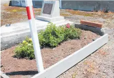  ??  ?? Now the grave of Lillah Annie Johnson has been restored. Tony Lozell, a local builder, donated and installed the new side boards. A group made a new wooden plaque.