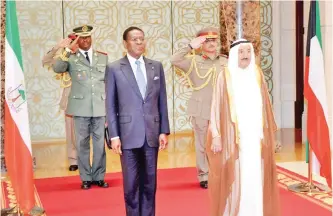  ??  ?? KUWAIT: His Highness the Amir Sheikh Sabah Al-Ahmad Al-Jaber Al-Sabah and President of Equatorial Guinea Teodoro Obiang Nguema Mbasogo look on as Kuwait’s Foreign Minister Sheikh Sabah Al-Khaled Al-Sabah and his Guinean counterpar­t Agapito Mba Mokuy sign a memorandum of understand­ing (MoU) regulating bilateral consultati­ons between the two countries. (Right) His Highness the Amir Sheikh Sabah Al-Ahmad Al-Jaber Al-Sabah and President of Equatorial Guinea Teodoro Obiang Nguema Mbasogo are pictured during Mbasogo’s official reception. — Amiri Diwan photos