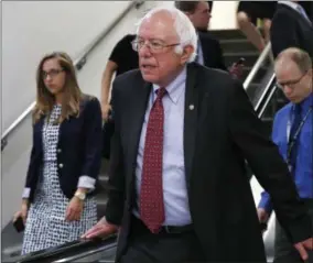  ??  ?? Sen. Bernie Sanders, I-Vt. rides an escalator on Capitol Hill in Washington.