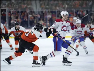  ?? MATT SLOCUM — ASSOCIATED PRESS ?? The newest Flyer, defenseman Jamie Drysdale, left, tries to slow Montreal’s Juraj Slafkovsky during the first period on Wednesday at the Wells Fargo Center. The Flyers won, 3-2, in a shootout. For updated informatio­n, go to delcotimes.com