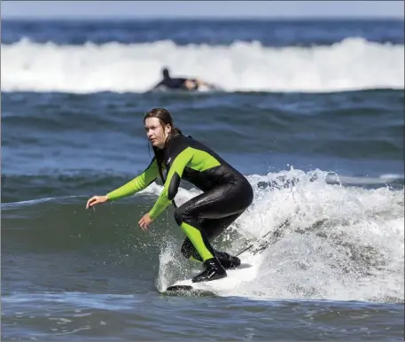  ??  ?? Surfing is one of the significan­t tourism attraction­s which Sligo offers. This surfer was pictured in Strandhill by photograph­er, Donal Hackett.