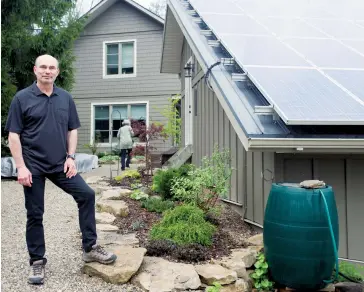  ??  ?? Zawadzki used green tech like solar panels and rainwater barrels for his new Eden Mills home