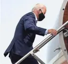  ?? PATRICK SEMANSKY/AP ?? Democratic presidenti­al candidate and former Vice President Joe Biden boards a plane at New Castle Airport in New Castle, Del., Tuesday, headed to Florida.