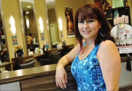  ?? BRENT DAVIS, RECORD STAFF ?? Angie DeLeo co-owns Le Salon at Kitchener’s Fairview Park mall. The business celebrates its 25th anniversar­y this year as the mall celebrates its 50th birthday. “I’m proud to be part of this property,” she says.
