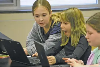  ?? BY HOLLY JENKINS ?? Coding is fun, according to RCES students (from left) Ava Stoner, Riley Garrido and Mackenzie Eisenmann.