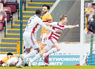  ??  ?? Hamilton’s Bruce Anderson celebrates netting the opening goal at Fir Park