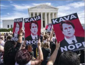  ?? AP PHOTO/J. SCOTT APPLEWHITE ?? Protesters rally against Supreme Court nominee Judge Brett Kavanaugh as the Senate Judiciary Committee debates his confirmati­on Friday at the Supreme Court in Washington.