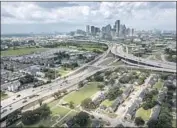  ?? Allen J. Schaben Los Angeles Times ?? A HOUSTON Housing Authority village, right, would be demolished if highway expansion plans go through.