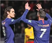  ?? (AFP) ?? PSG’s Edinson Cavani (left) celebrates with his teammate after scoring against Linas-Montlhery during their French Cup match on Sunday
