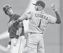  ?? David Dermer / Associated Press ?? Astros shortstop Carlos Correa, returning the ball to the pitcher Friday night, has not made an error this season.