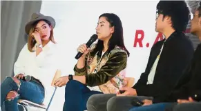  ??  ?? Traumatic experience­s: Lisa (centre) and Chia struggling to hold back their tears while sharing their own accounts of being bullied during a panel session at the event as JinnyBoy looks on.