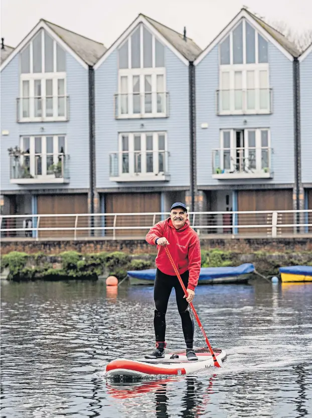  ?? ?? Wassup? Learning to paddle board has given Mark a real sense of achievemen­t