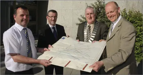  ??  ?? Chief Librarian Brendan Martin, Bryan Doyle, Chief Executive of Wicklow County Council, Cllr Pat Fitzgerald, cathaoirle­ach of Wicklow County Council and Director of Services Michael Nicholson with the copy of the 1856 Public lighting charter which is going on display.