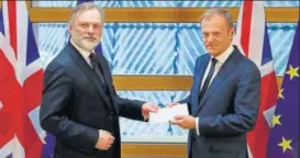 ??  ?? Britain's permanent representa­tive to the European Union Tim Barrow (left) delivers British Prime Minister Theresa May's Brexit letter to EU Council President Donald Tusk, in Brussels, Belgium, on Wednesday. The letter formally triggers the beginning...