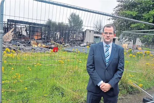  ??  ?? DEVASTATIO­N: Aberdeen Donside MSP Mark McDonald, at the burned-out Cordyce school, has highlighte­d the danger to communitie­s