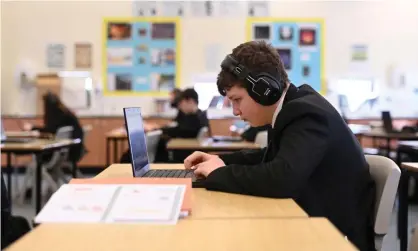  ?? Photograph: Oli Scarff/AFP/Getty Images ?? An online lesson at Park Lane academy, Halifax. ‘The question now arises: why employ tutors, teachers, or anyone who does anything that can be done remotely, in countries where wages and living costs are high?’