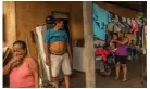  ?? Photograph: Daniele Volpe/ The Guardian ?? Nanda Morales, 59 (pink shirt), and Rosendo Garcia, 55 (turquoise shirt), in the provisiona­l house to which they were forced to move with Luisa (purple shirt) and their children.