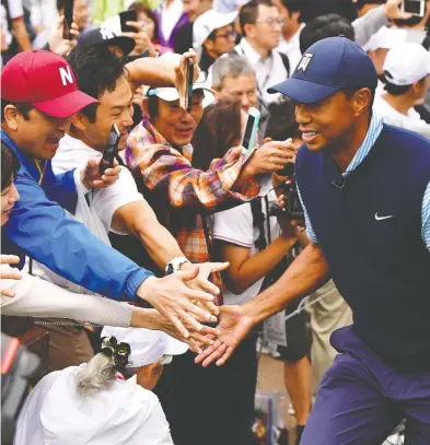  ?? ATSUSHI TOMURA / GETTY IMAGES ?? Tiger Woods hasn’t had many highlights since stunningly winning his fifth green jacket in April.