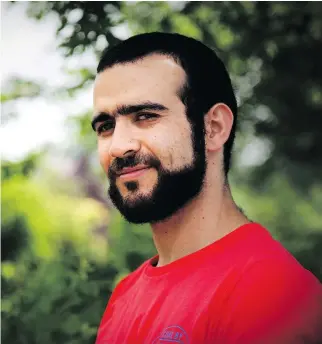  ?? COLIN PERKEL/THE CANADIAN PRESS ?? Former Guantanamo Bay prisoner Omar Khadr, 30, is seen in Mississaug­a, Ont. on Thursday, The federal government has paid Khadr $10.5 million and apologized to him for his ordeal.