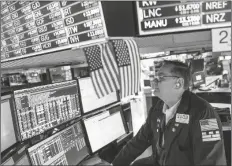  ?? TRADER PATRICK KING JOHN MINCHILLO/AP ?? works the floor at the New York Stock Exchange on Thursday in New York.