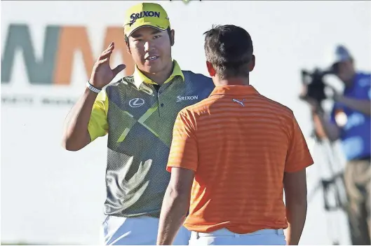  ?? DAVID KADLUBOWSK­I/AZCENTRAL SPORTS ?? Hideki Matsuyama meets with Rickie Fowler after defeating him on the fourth playoff hole after the final round of the Waste Management Phoenix Open at TPC Scottsdale on Sunday.