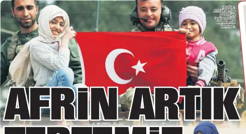  ??  ?? Çocuklar, Afrin’de devriye gezen Türk tanklarını Türk bayrakları ile karşılıyor.